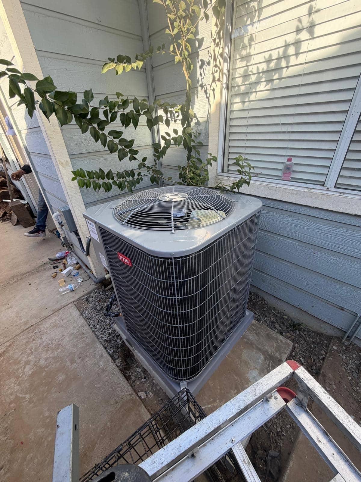 Carrier outdoor heating and cooling condenser unit serviced in Brentwood CA