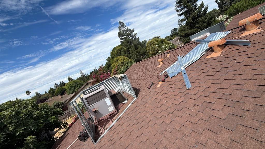 Rooftop air duct frame and HVAC installation on residential shingles in Brentwood CA